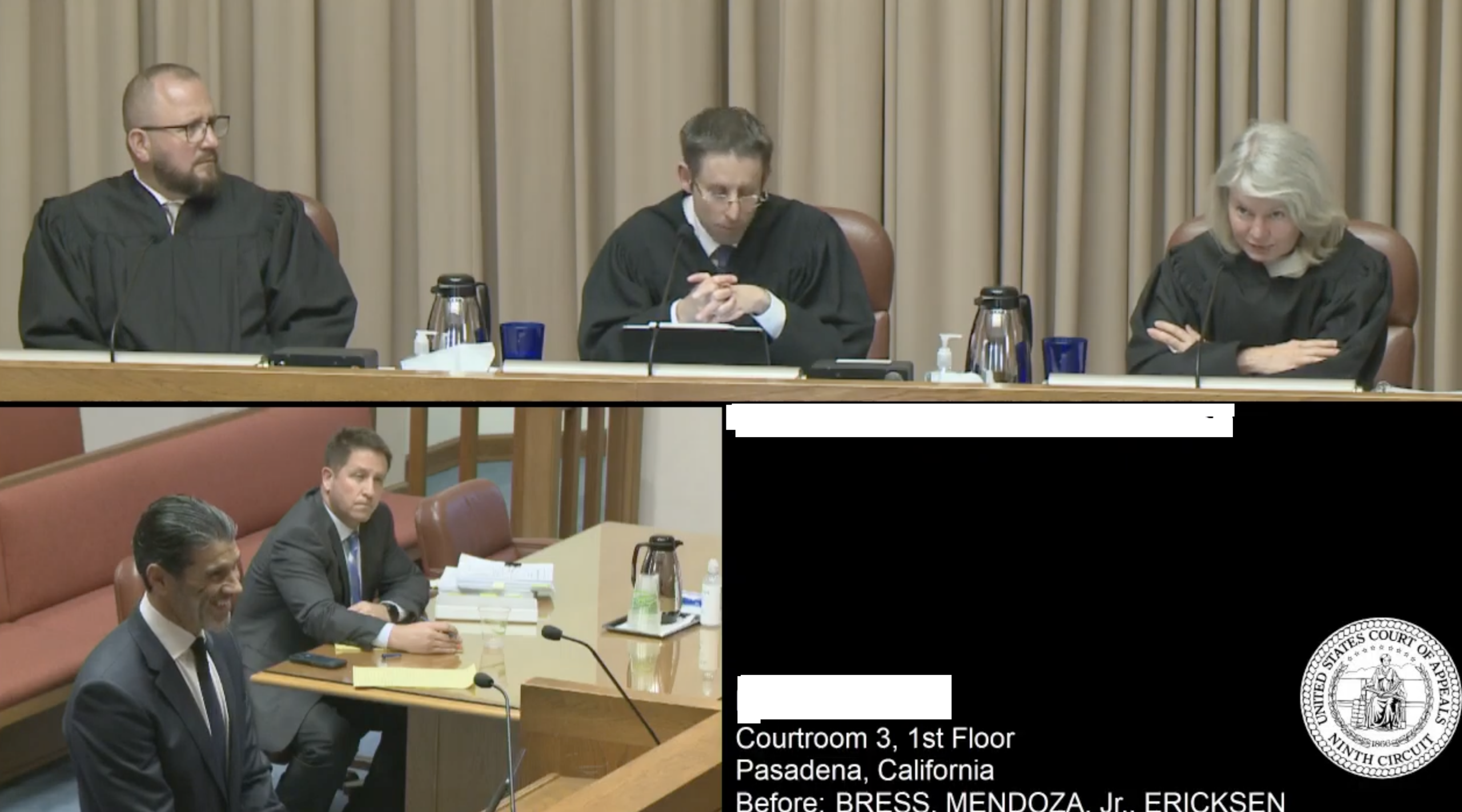 A court hearing with a judge and a lawyer presenting documents.